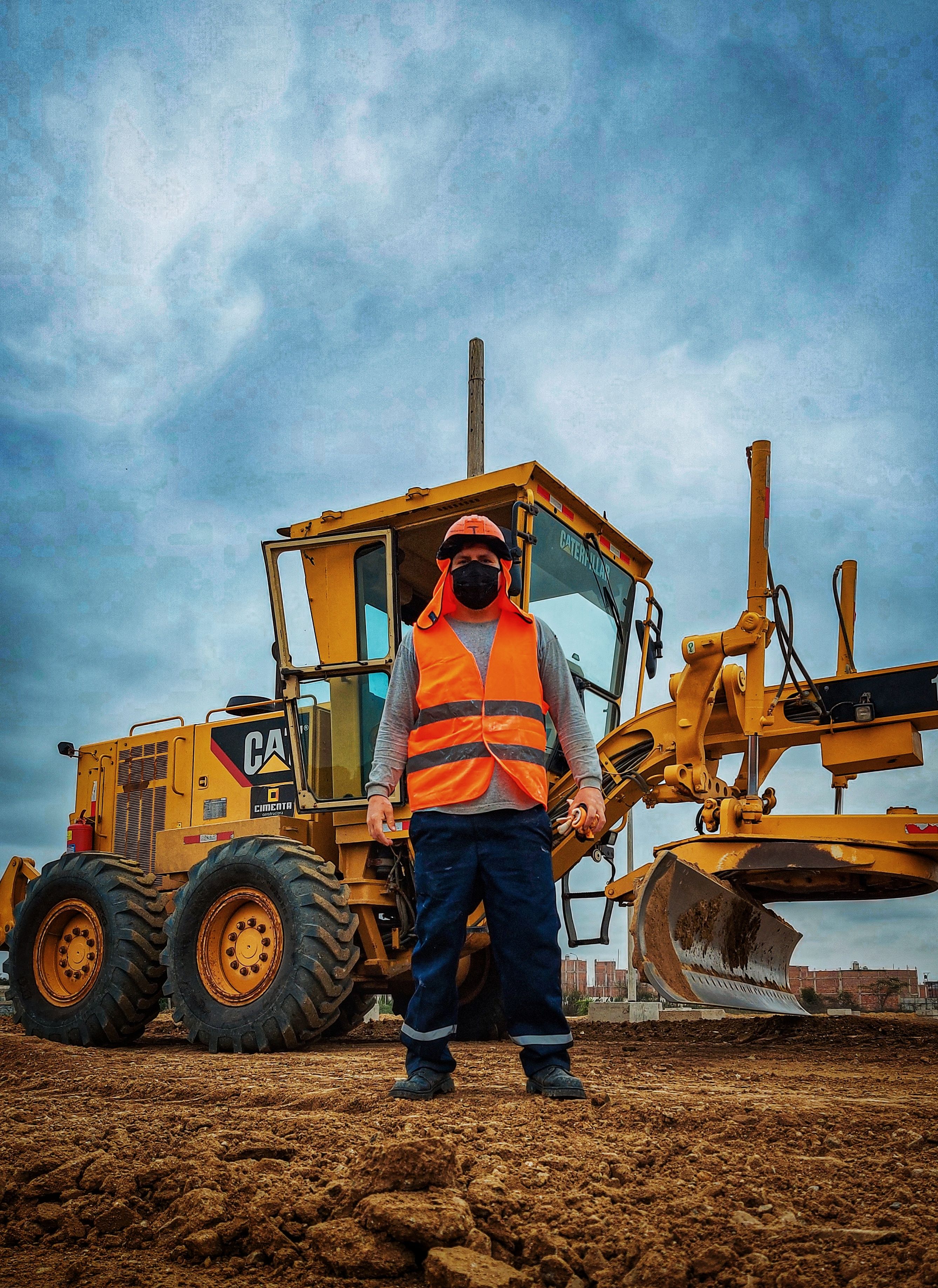 Construction workers wearing complete personal protective equipment